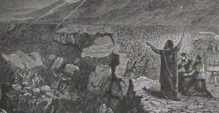 dark photo with people and rocks